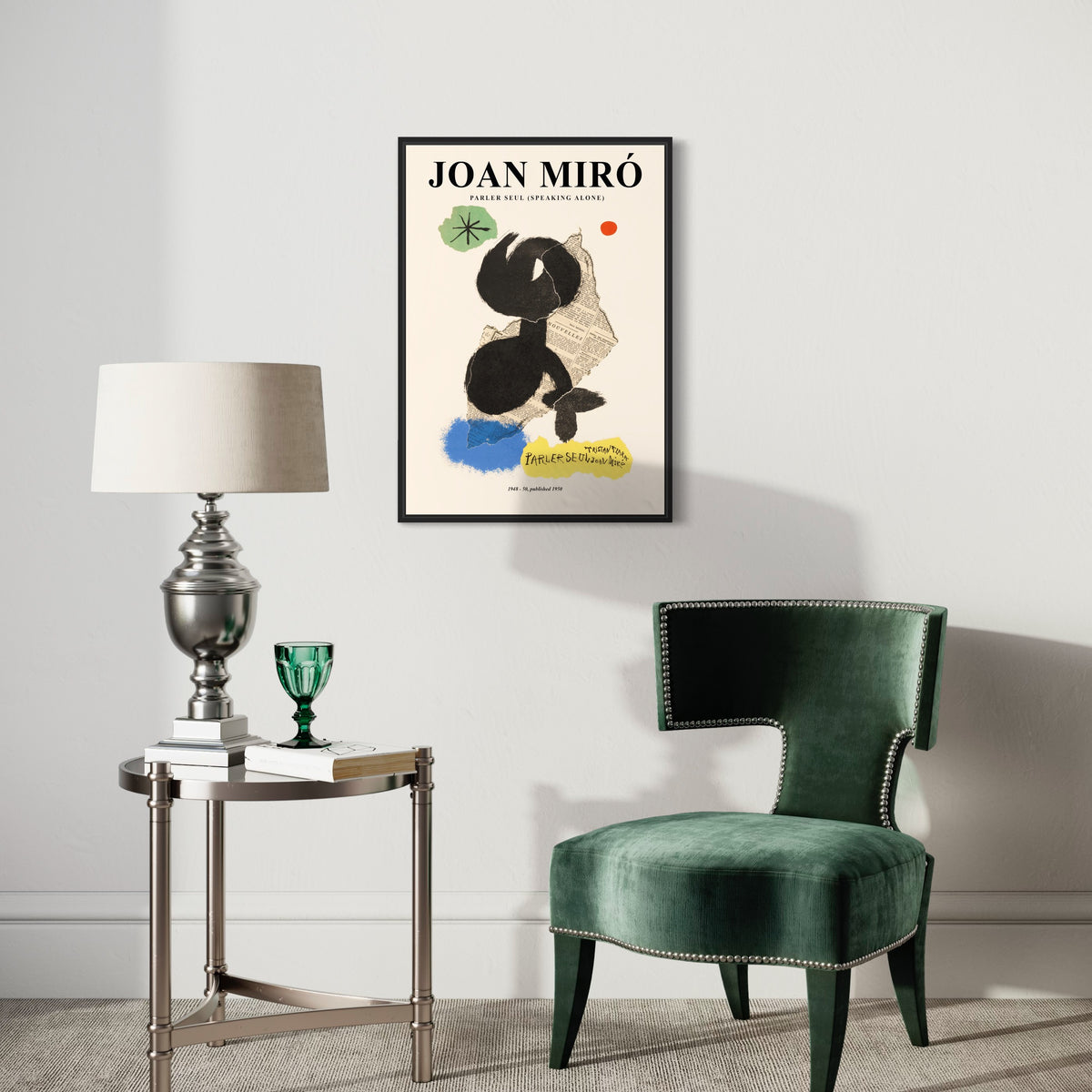 Modern living room with abstract Joan Miró art poster, green velvet chair, and silver lamp