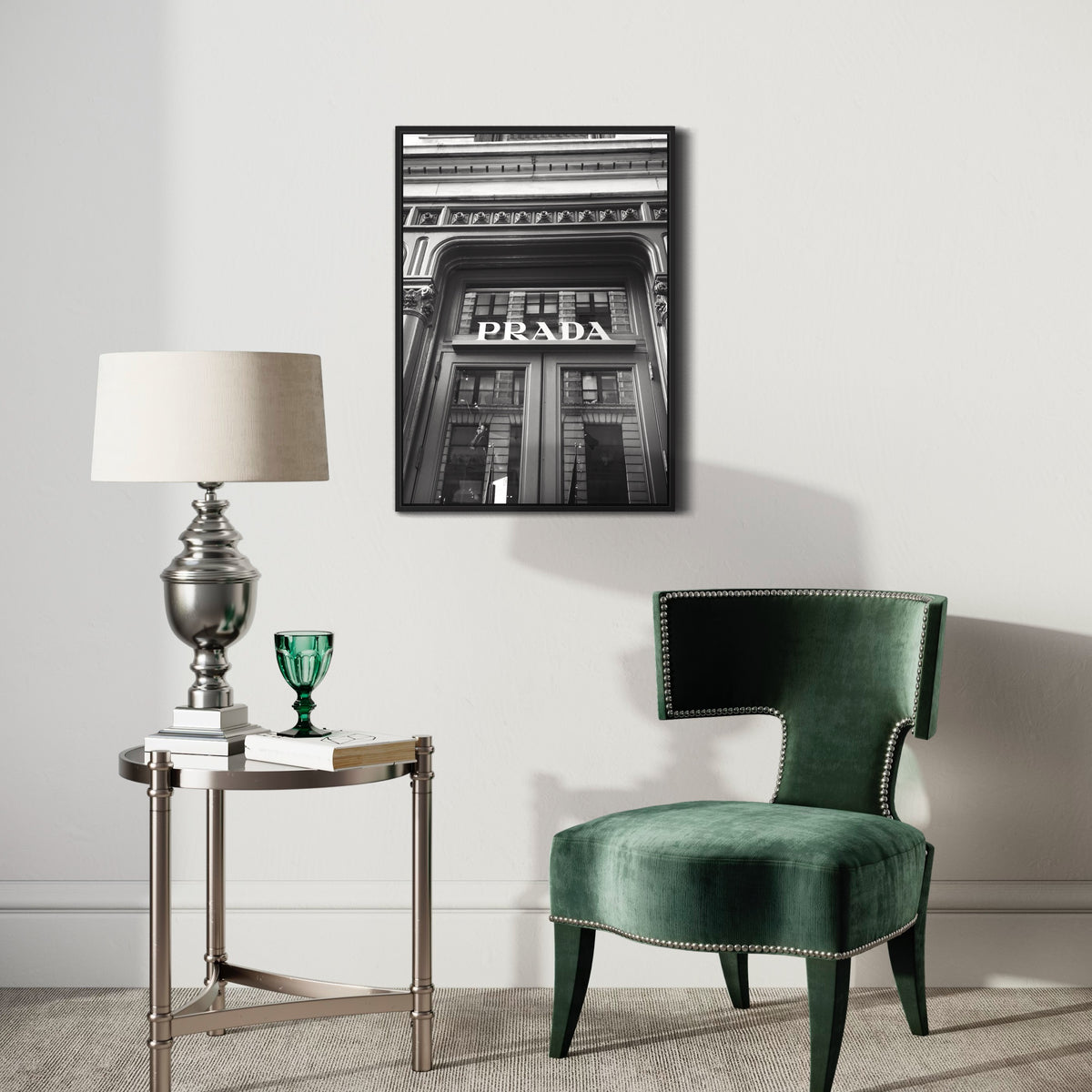 Black and white Prada poster in stylish living room with velvet chair and side table.