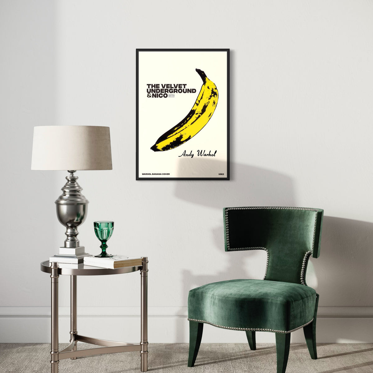 Minimalist living room with Andy Warhol banana poster, velvet chair, lamp and green glass