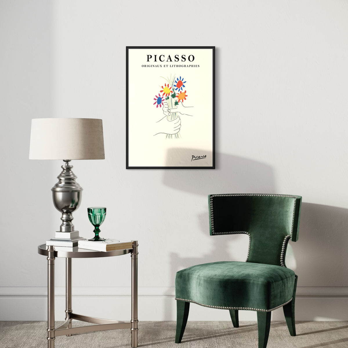 Modern living room with green velvet chair, metallic lamp table, and Picasso poster wall art