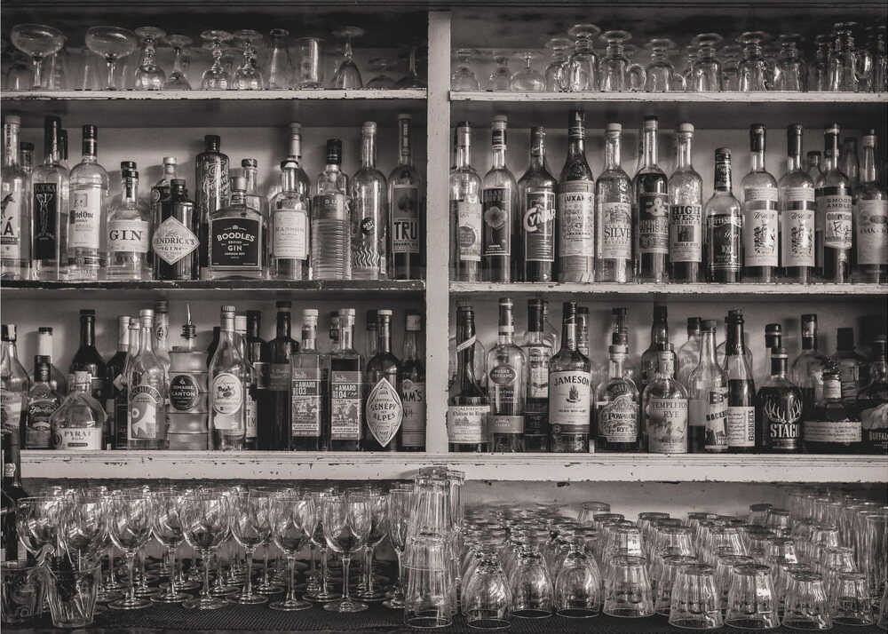 Bar shelf bw poster with a black and white view of a bar shelf with liquor bottles and glasses