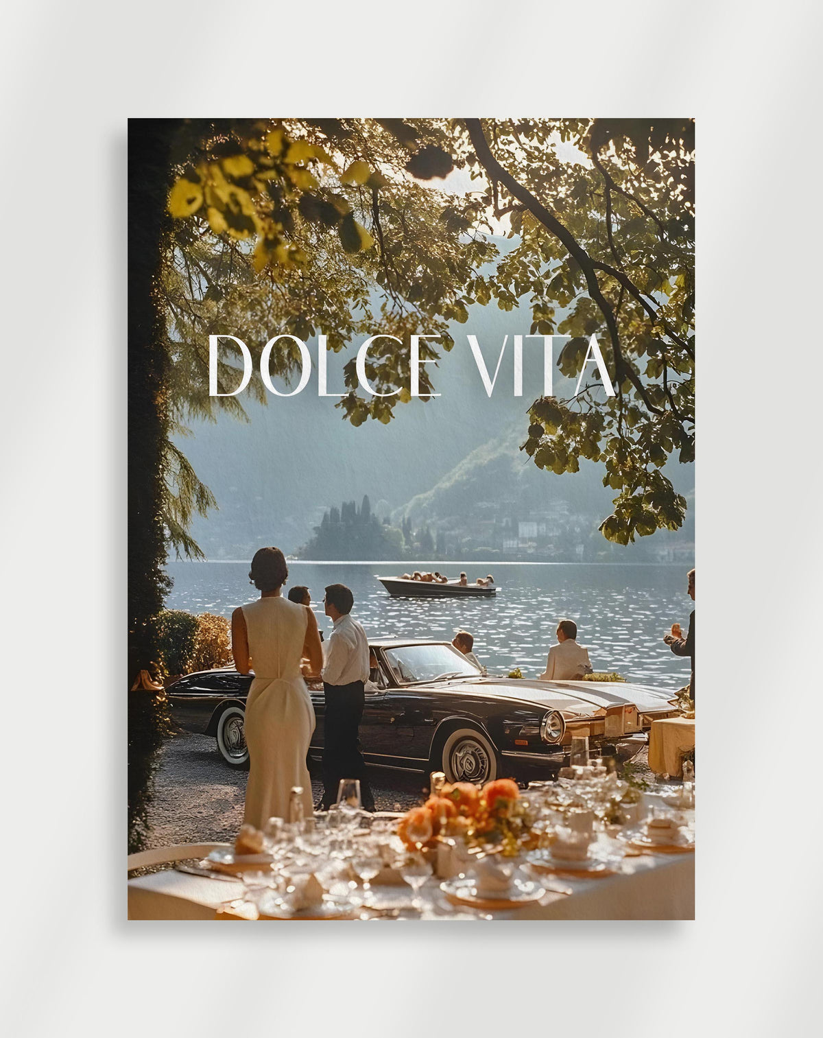 Dolce Vita lake poster with people by a black convertible at a lakeside dinner with DOLCE VITA text