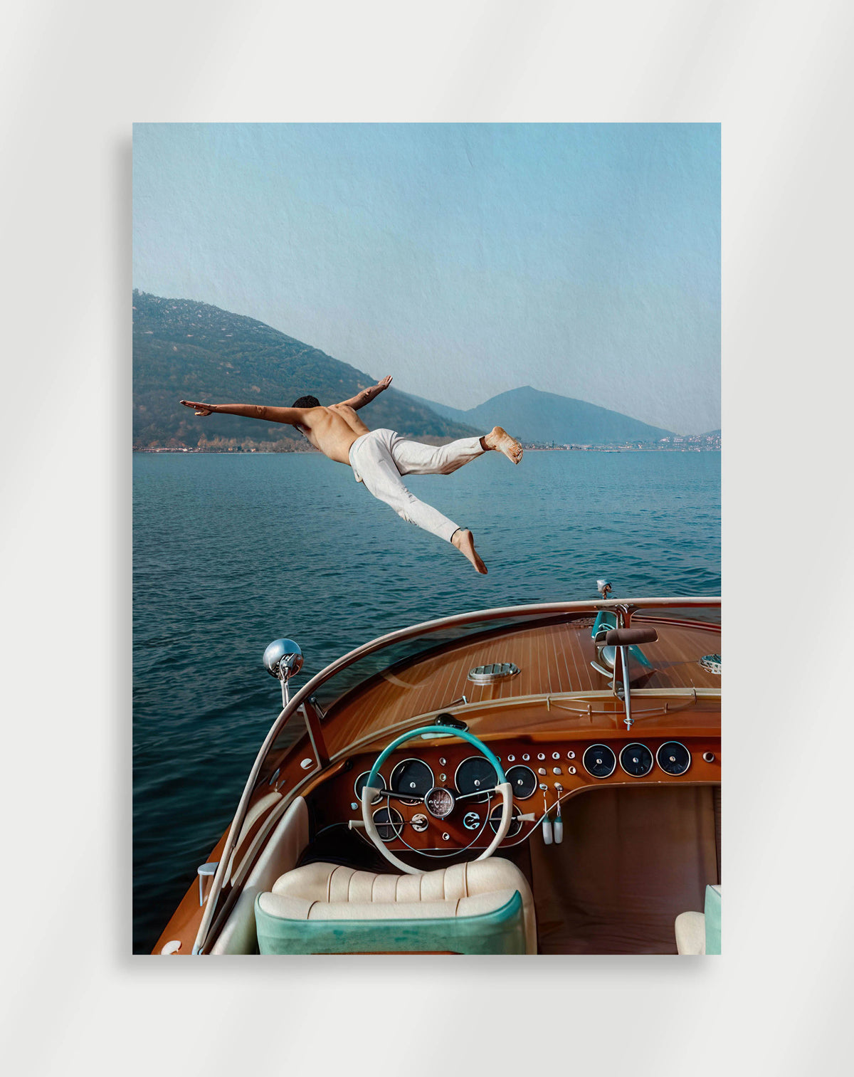 Man diving boat poster with a man diving into a lake from a vintage wooden boat