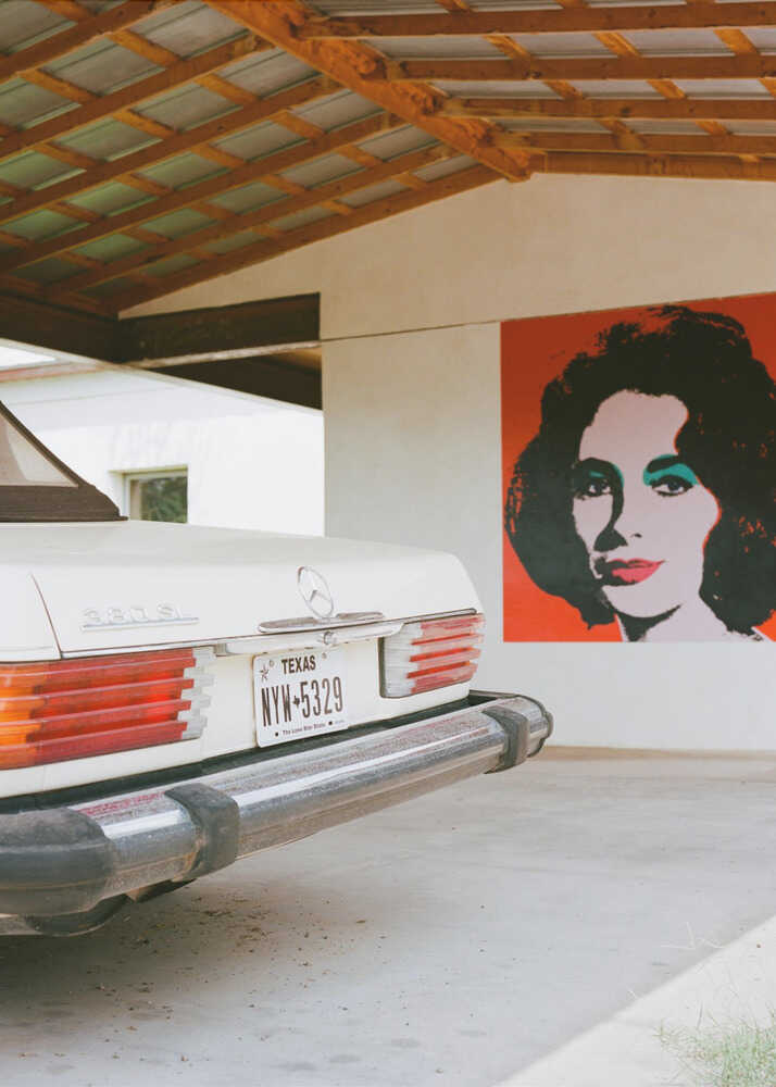 Mercedes pop art poster with a white Mercedes and a pop art portrait of a woman on the wall
