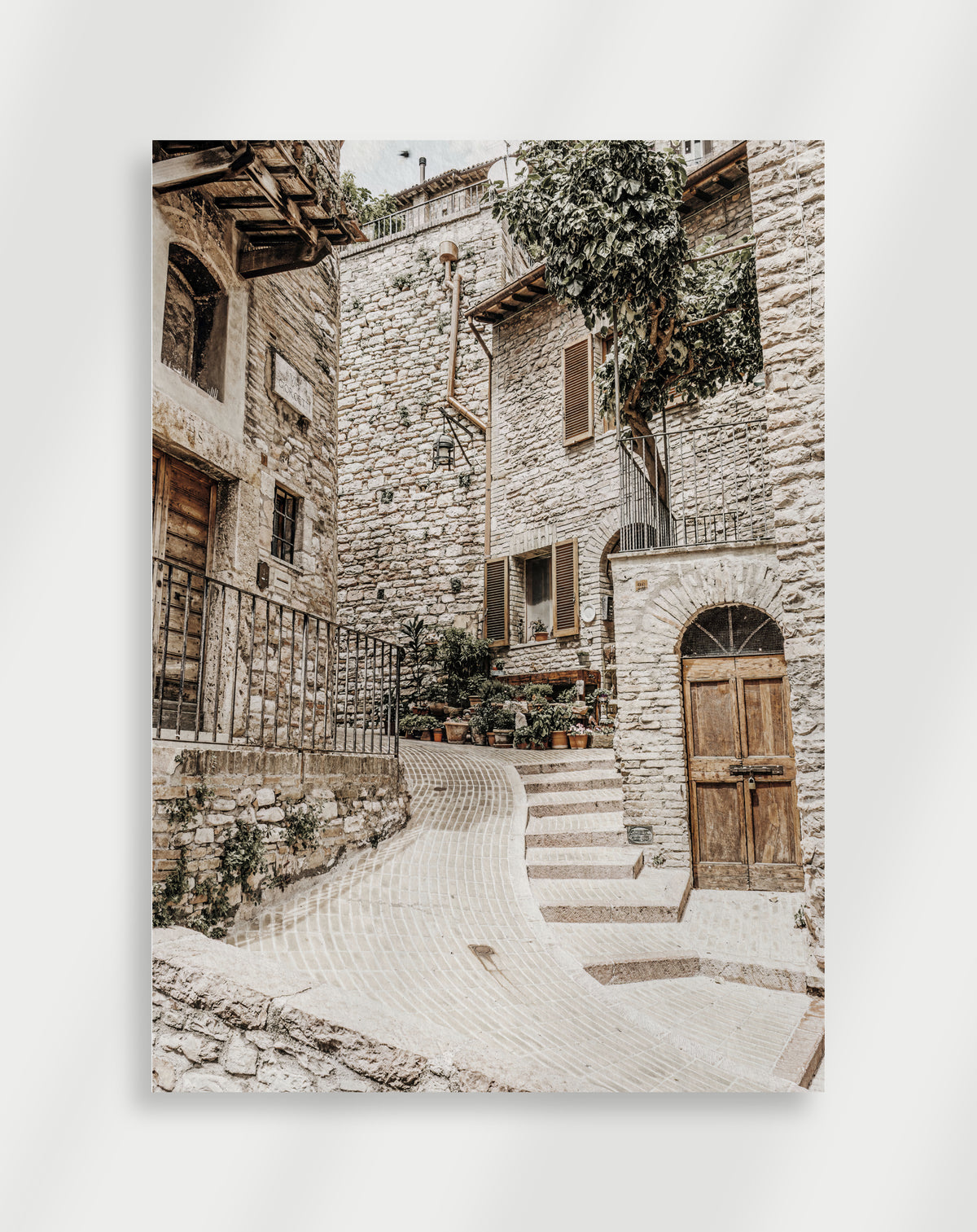 Stone alley wooden door poster with a narrow cobblestone alley in a stone village with a wooden door and steps