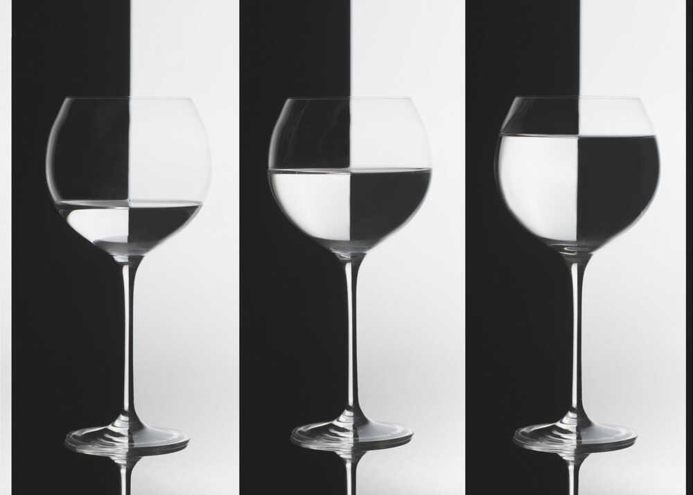 Three wine glasses poster with a black and white view of three wine glasses with different liquid levels