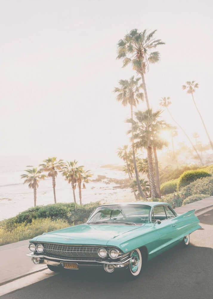 Turquoise vintage car poster with a turquoise vintage car by the ocean and palm trees