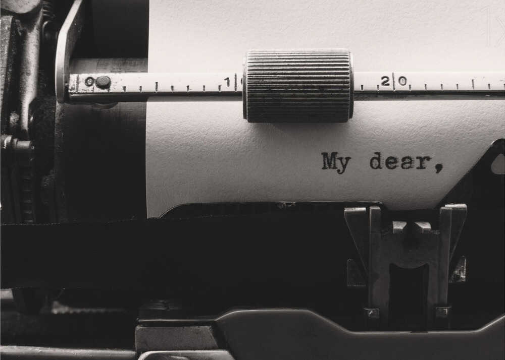 Typewriter my dear poster with a black and white close-up of a typewriter typing My dear