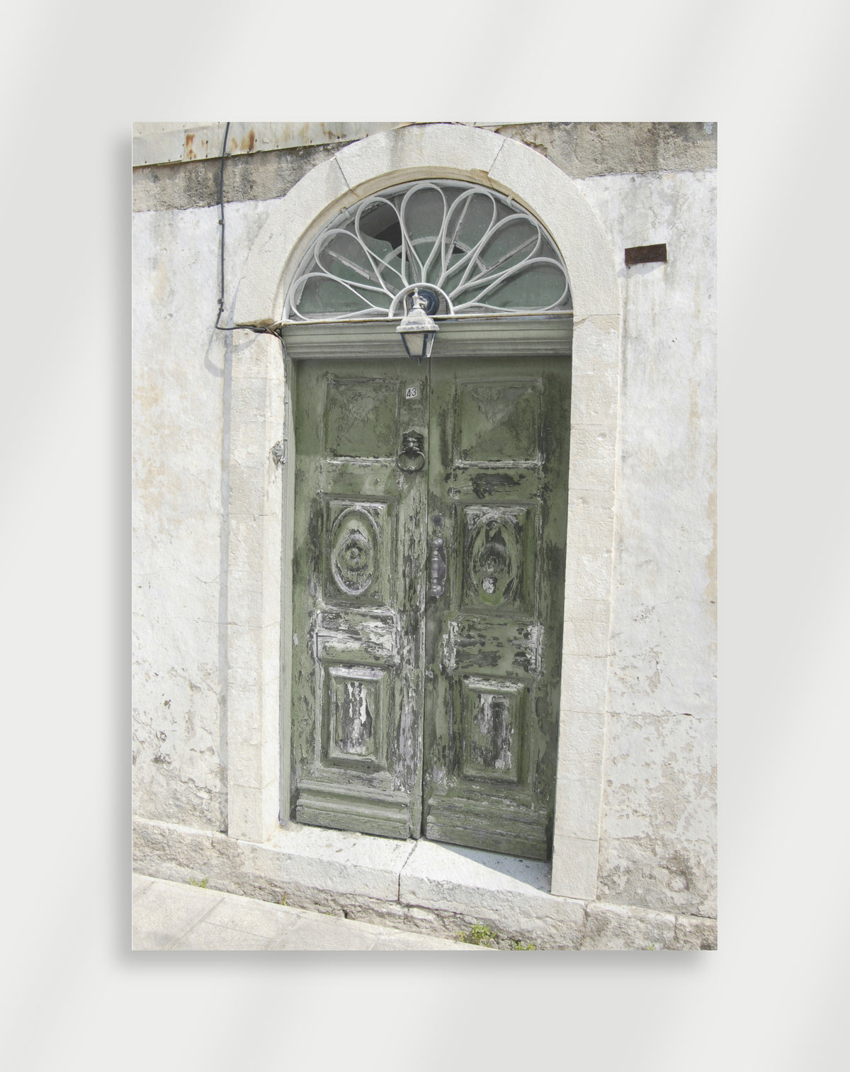 Weathered green door poster with a weathered green double door and fanlight on a white wall